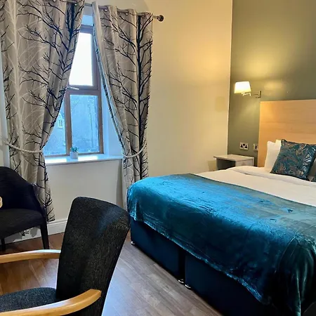 Отель The Coach House 3*